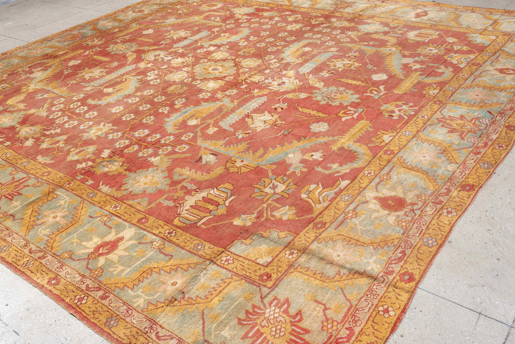 13' x 13' one-of-a-kind handmade antique Oushak oversize rug. Color palette: terracotta, aqua, gold, ivory, camel, sage