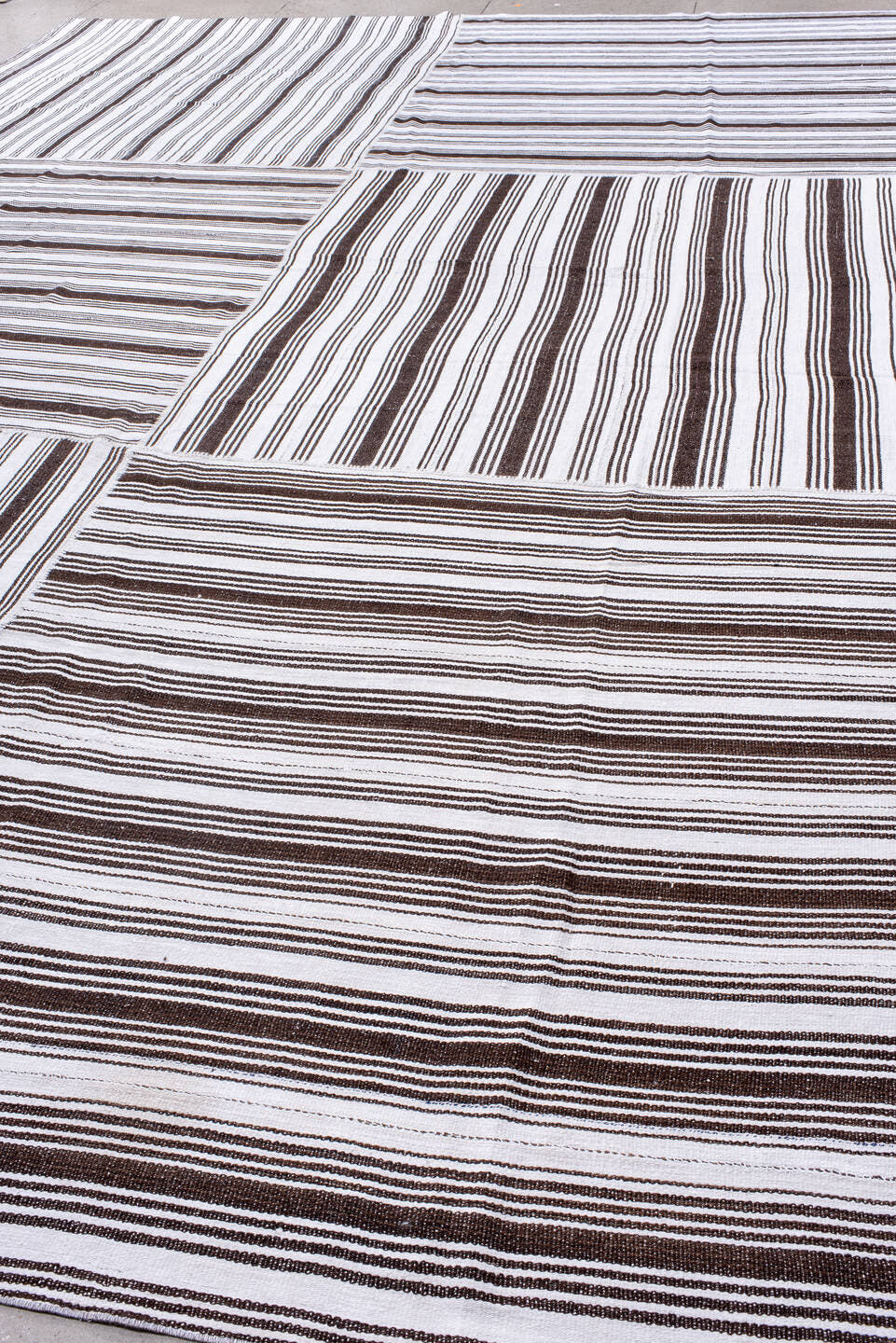 12' x 18' one-of-a-kind handmade antique Flatweave oversize rug. Color palette: ivory, dark brown, brown