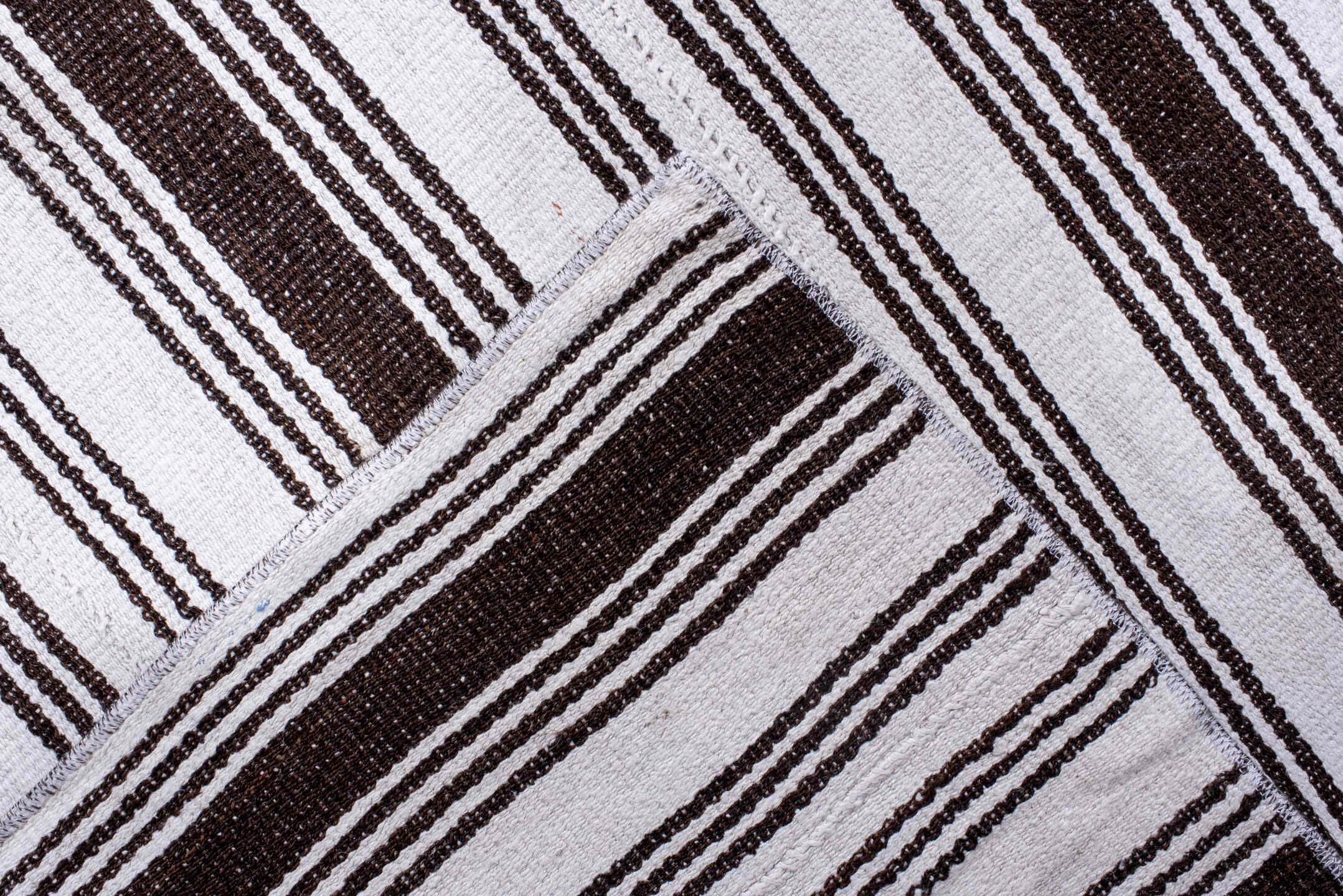 12' x 18' one-of-a-kind handmade antique Flatweave oversize rug. Color palette: ivory, dark brown, brown