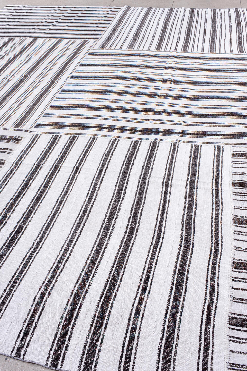 12' x 16' one-of-a-kind handmade antique Flatweave oversize rug. Color palette: ivory, charcoal, gray, black