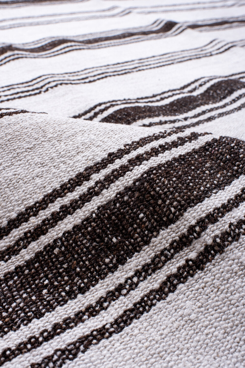 12' x 16' one-of-a-kind handmade antique Flatweave oversize rug. Color palette: ivory, charcoal, gray, black