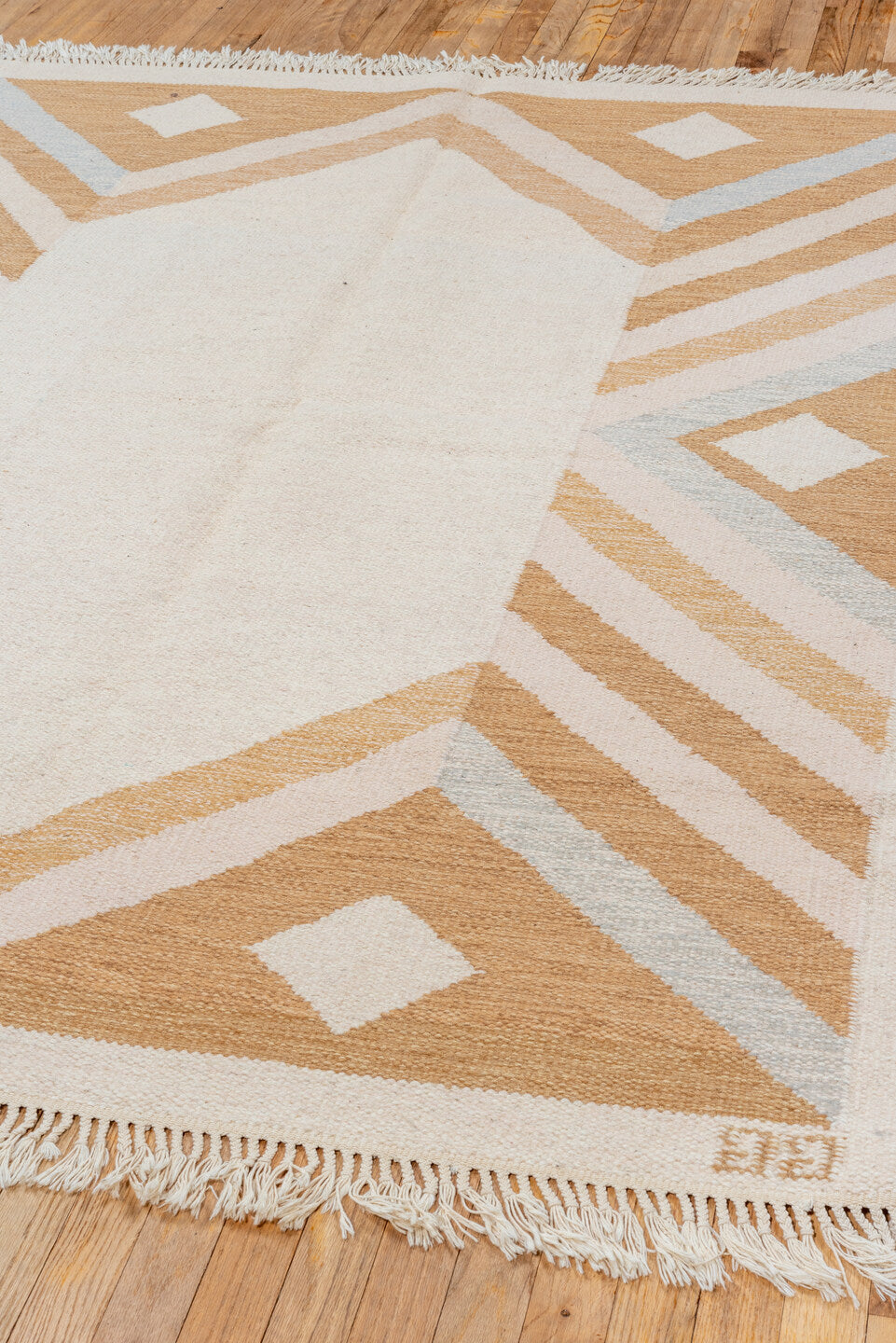 5' x 7' one-of-a-kind handmade vintage Rollaken rug. Color palette: ivory, camel, cream, pale_blue, beige, light blue