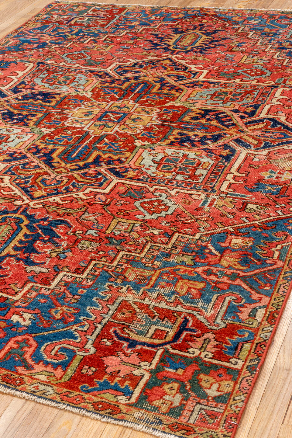 5' x 8' one-of-a-kind handmade vintage Heriz medium size rug. Color palette: coral, navy, sky blue, ivory, rust, sage, camel