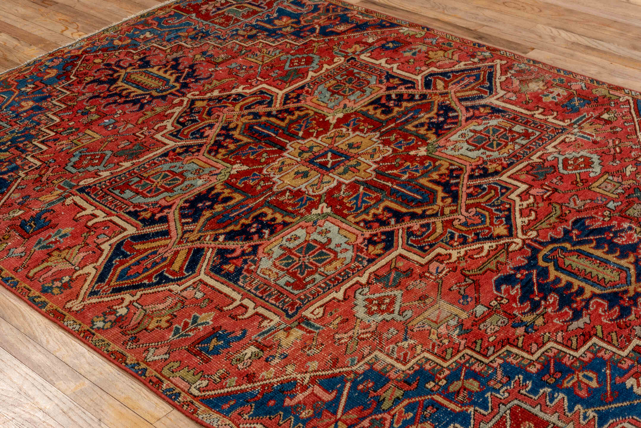 5' x 8' one-of-a-kind handmade vintage Heriz medium size rug. Color palette: coral, navy, sky blue, ivory, rust, sage, camel