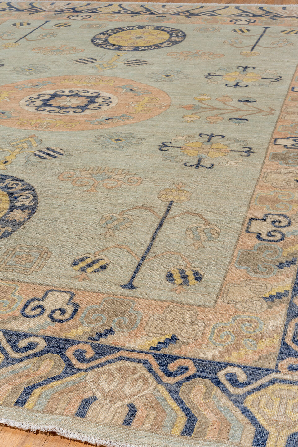10' x 14' one-of-a-kind handmade vintage Khotan large size rug. Color palette: pale blue, ivory, navy, blush, beige, gold