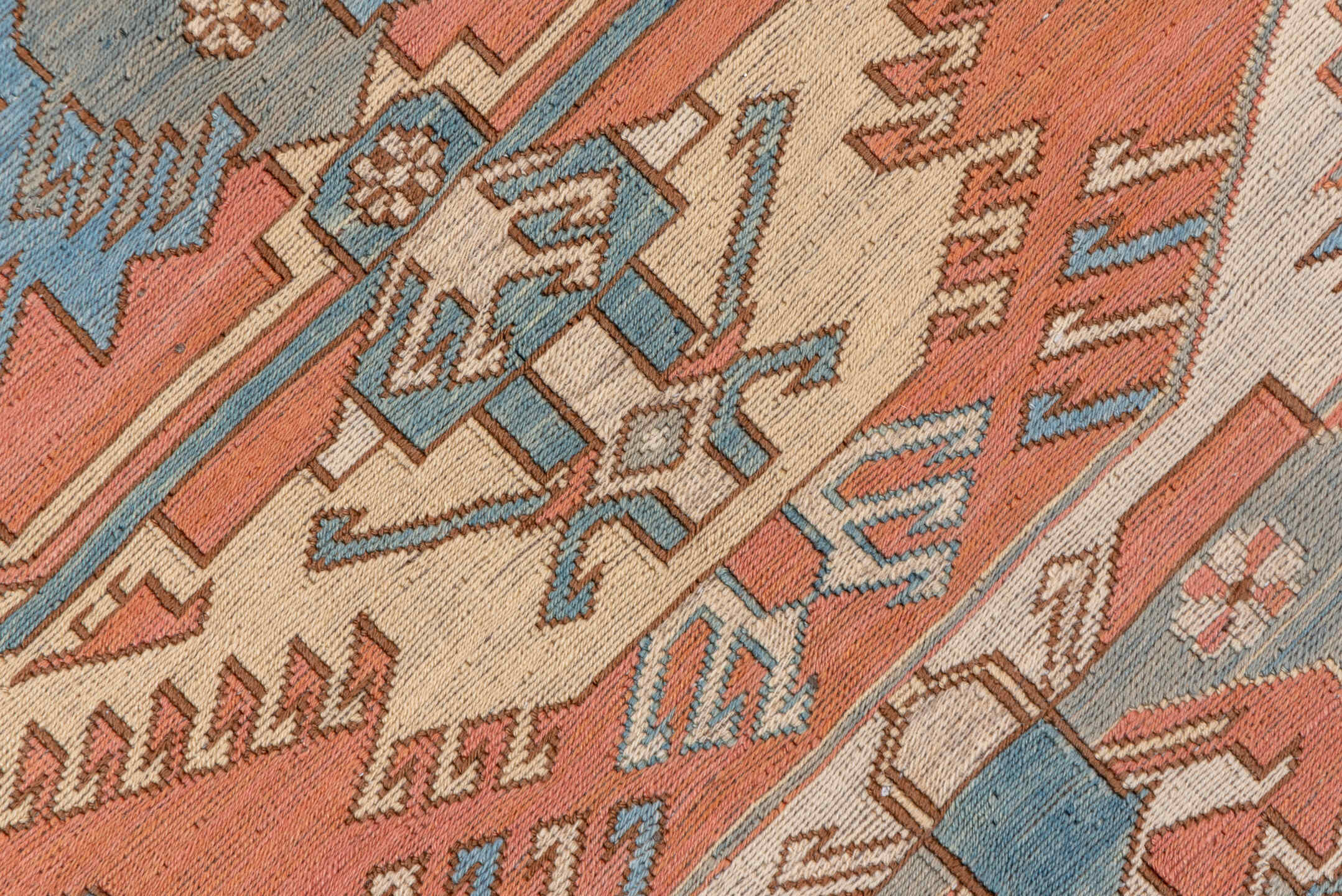 7' x 9' one-of-a-kind handmade vintage Sumak rug. Color palette: salmon, ivory, dusty blue, taupe, rust, beige, pink, blue
