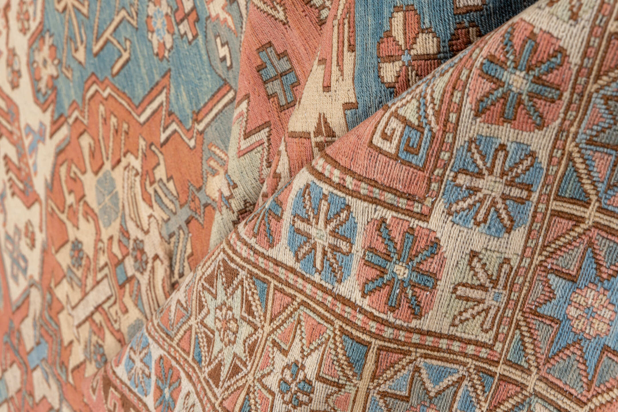 7' x 9' one-of-a-kind handmade vintage Sumak rug. Color palette: salmon, ivory, dusty blue, taupe, rust, beige, pink, blue