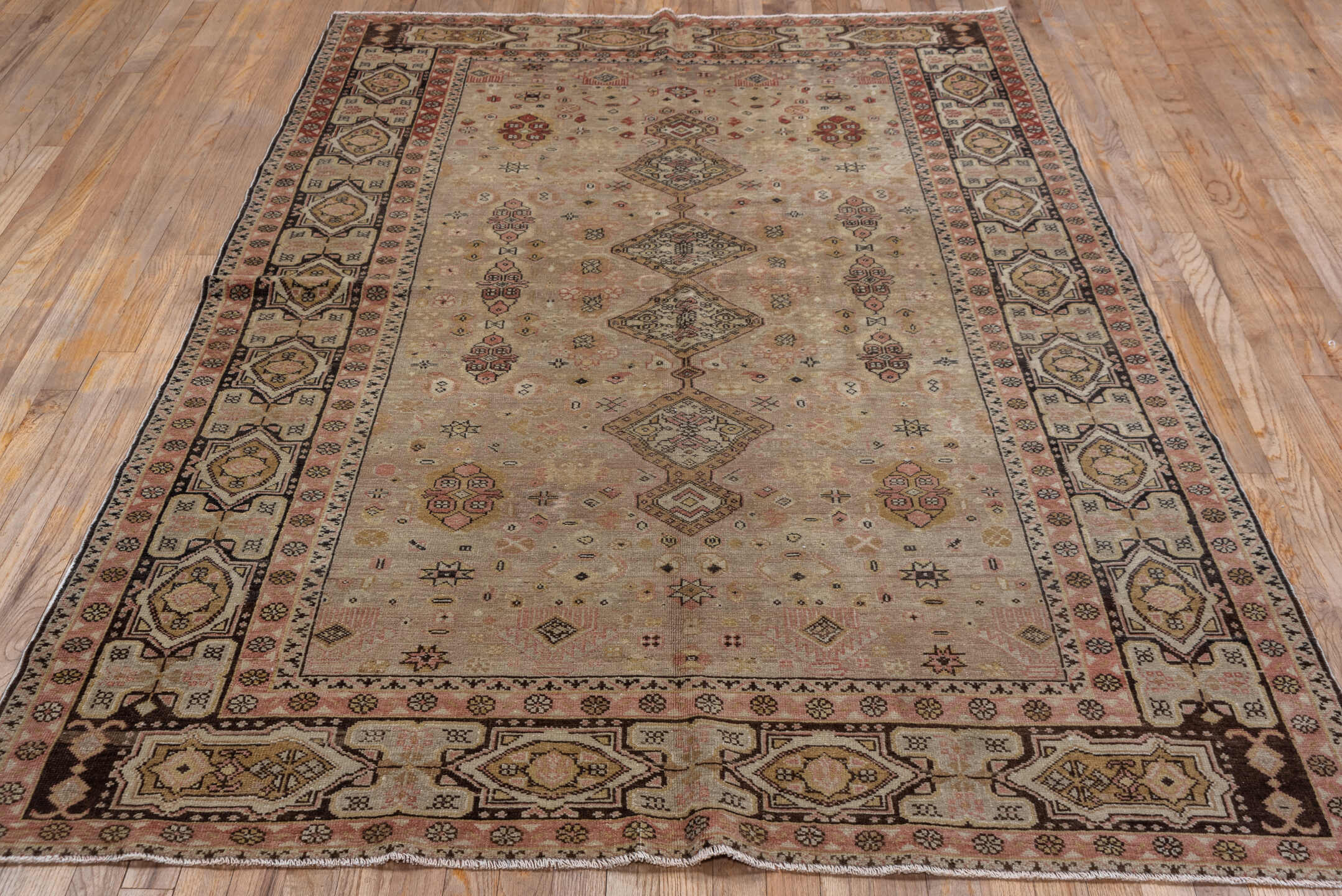 5' x 7' one-of-a-kind handmade vintage Oushak rug. Color palette: beige, rose, taupe, brown, ivory, rust, charcoal, gold