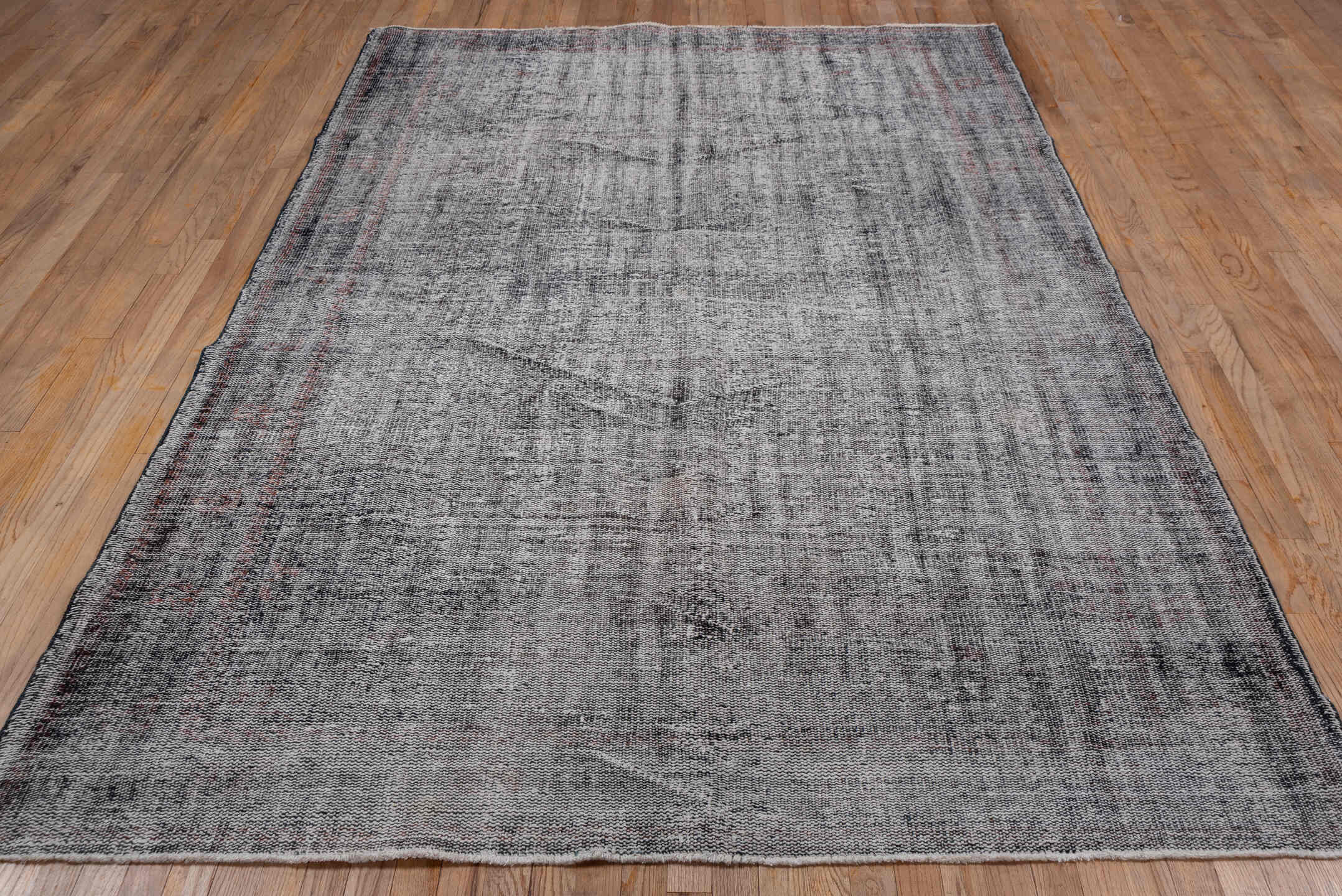 6' x 9' one-of-a-kind handmade vintage Overdyed medium size rug. Color palette: gray, charcoal, ivory, taupe, rose, black