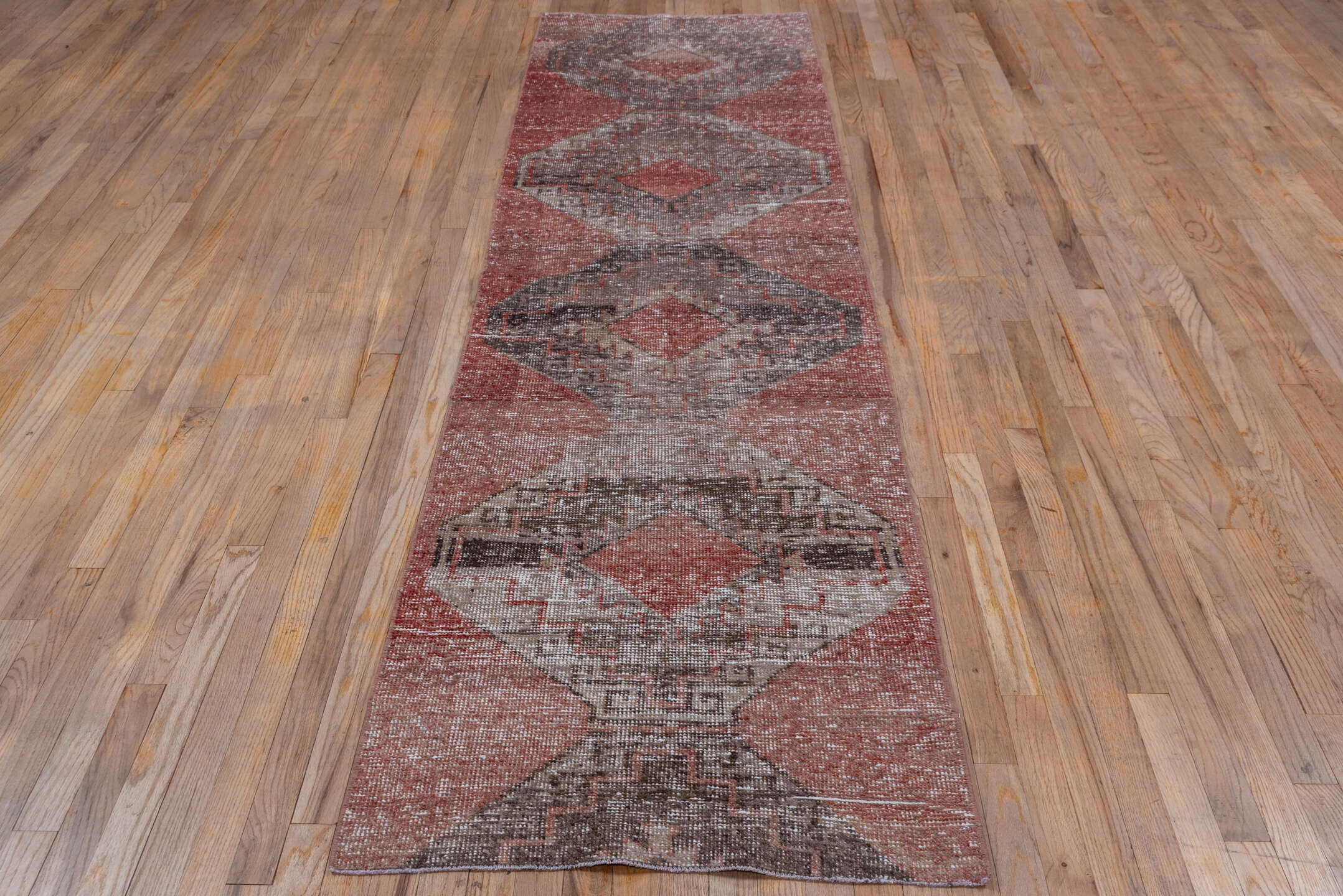 2' x 10' one-of-a-kind handmade vintage Oushak runner rug. Color palette: brown, gray, light gray, off-white, pink, red