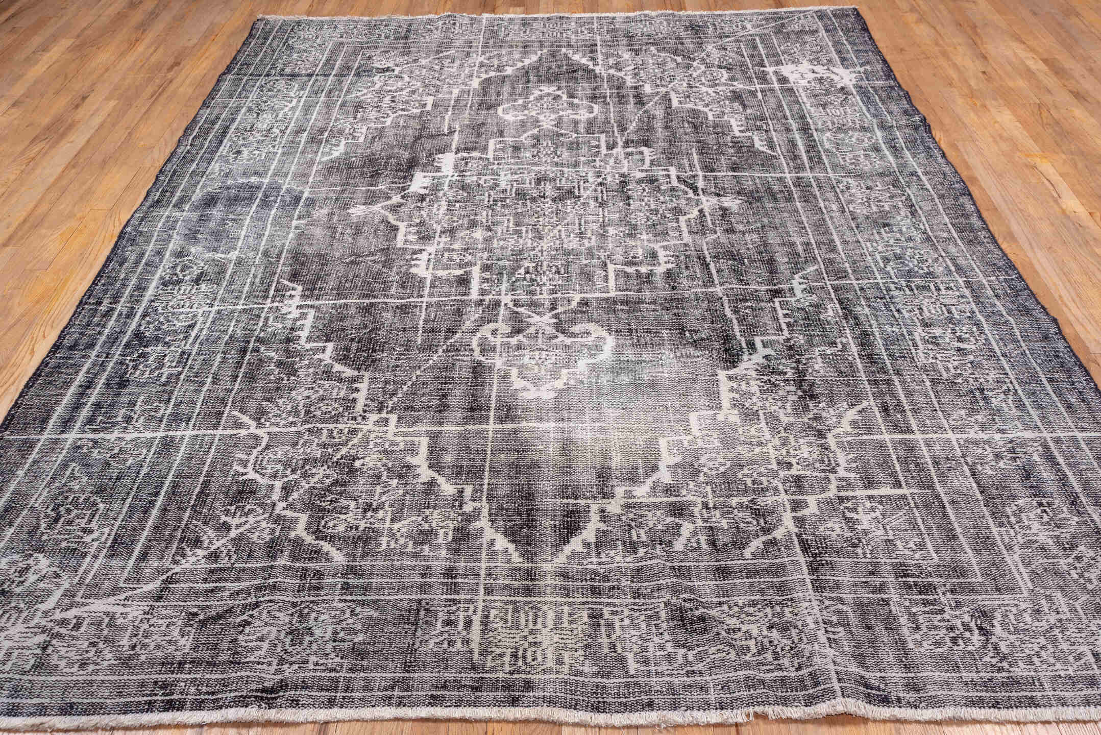 7' x 9' one-of-a-kind handmade vintage Overdyed rug. Color palette: charcoal, ivory, taupe, slate, gray, black, beige