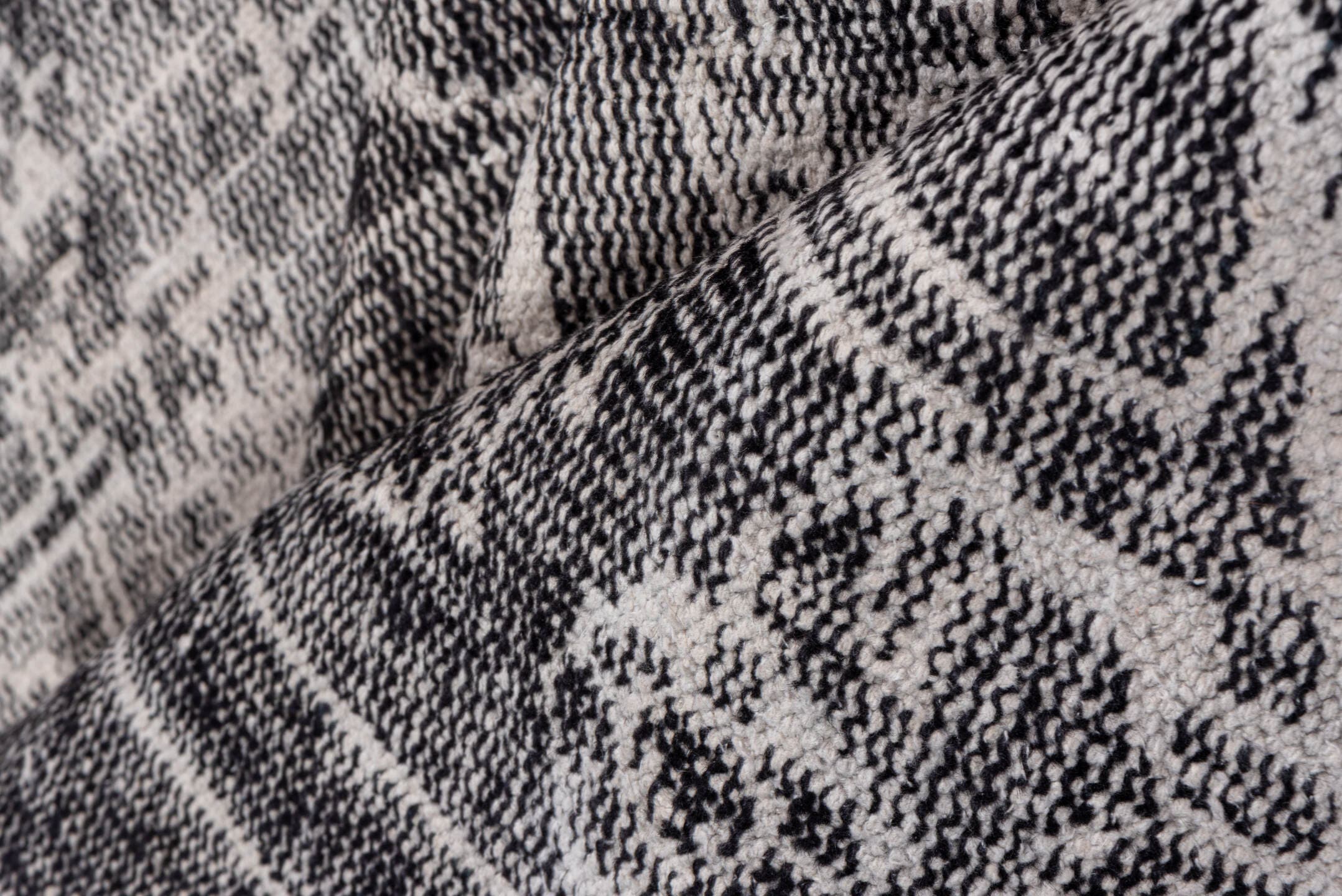 7' x 9' one-of-a-kind handmade vintage Overdyed rug. Color palette: charcoal, ivory, taupe, slate, gray, black, beige