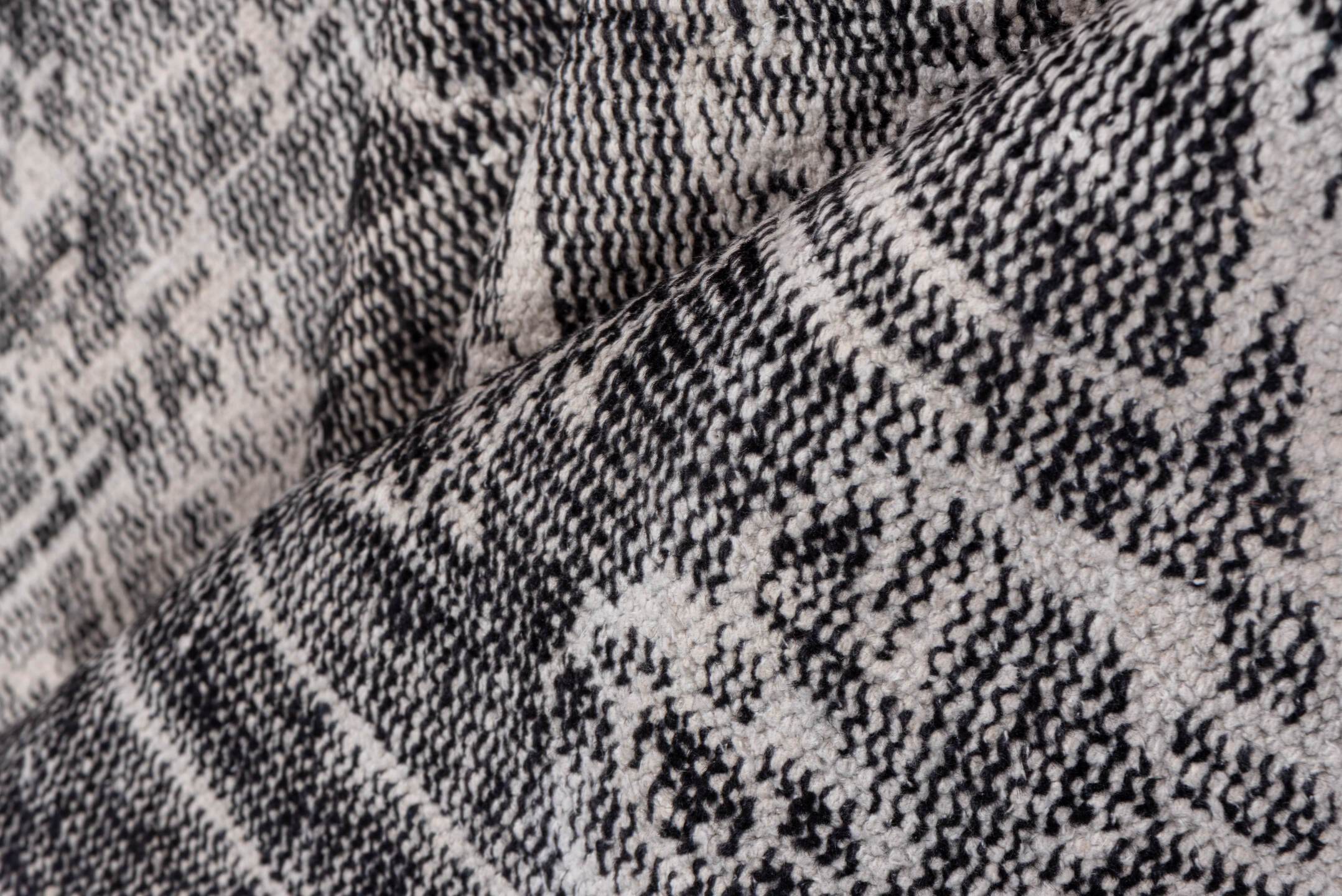 7' x 9' one-of-a-kind handmade vintage Overdyed rug. Color palette: charcoal, ivory, taupe, slate, gray, black, beige