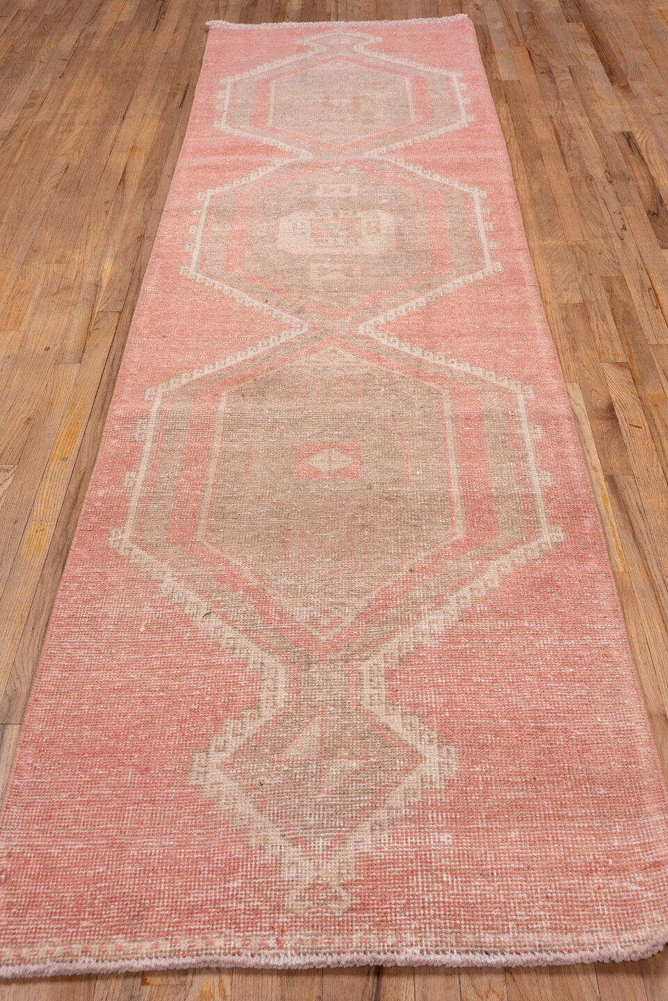 3' x 11' one-of-a-kind handmade vintage Oushak runner rug. Color palette: brown, off-white, orange, pink, snow, white