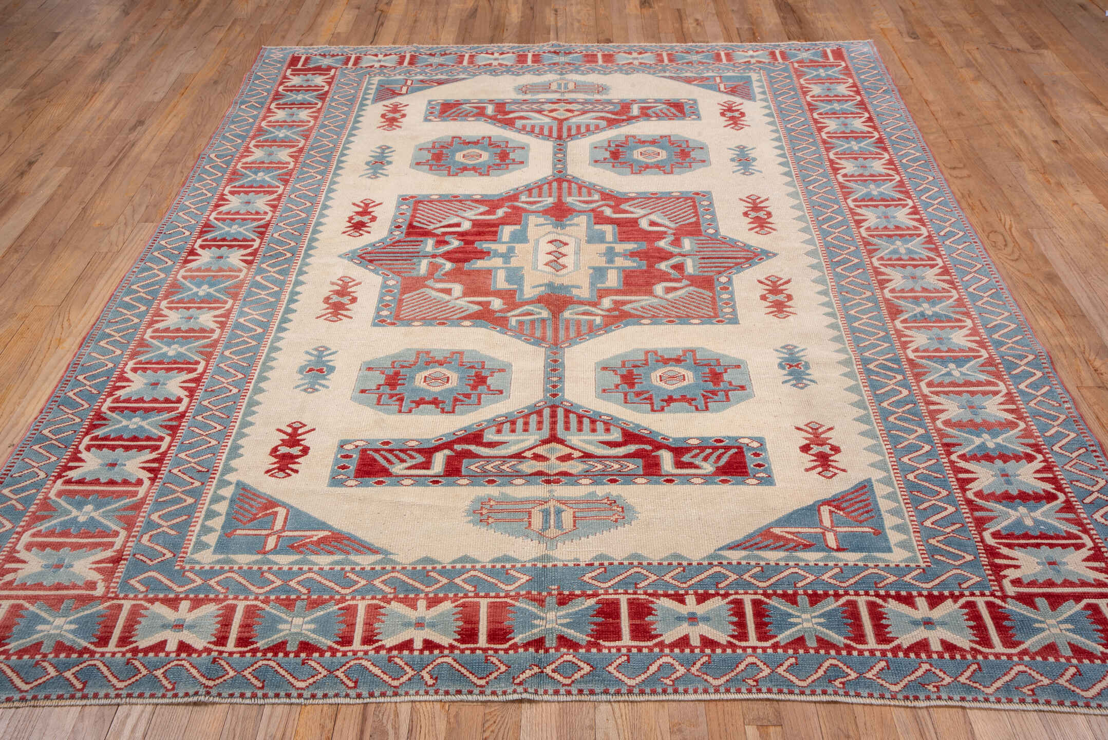 7' x 9' one-of-a-kind handmade vintage Oushak rug. Color palette: ivory, sky blue, rust, brick red, cream, light blue