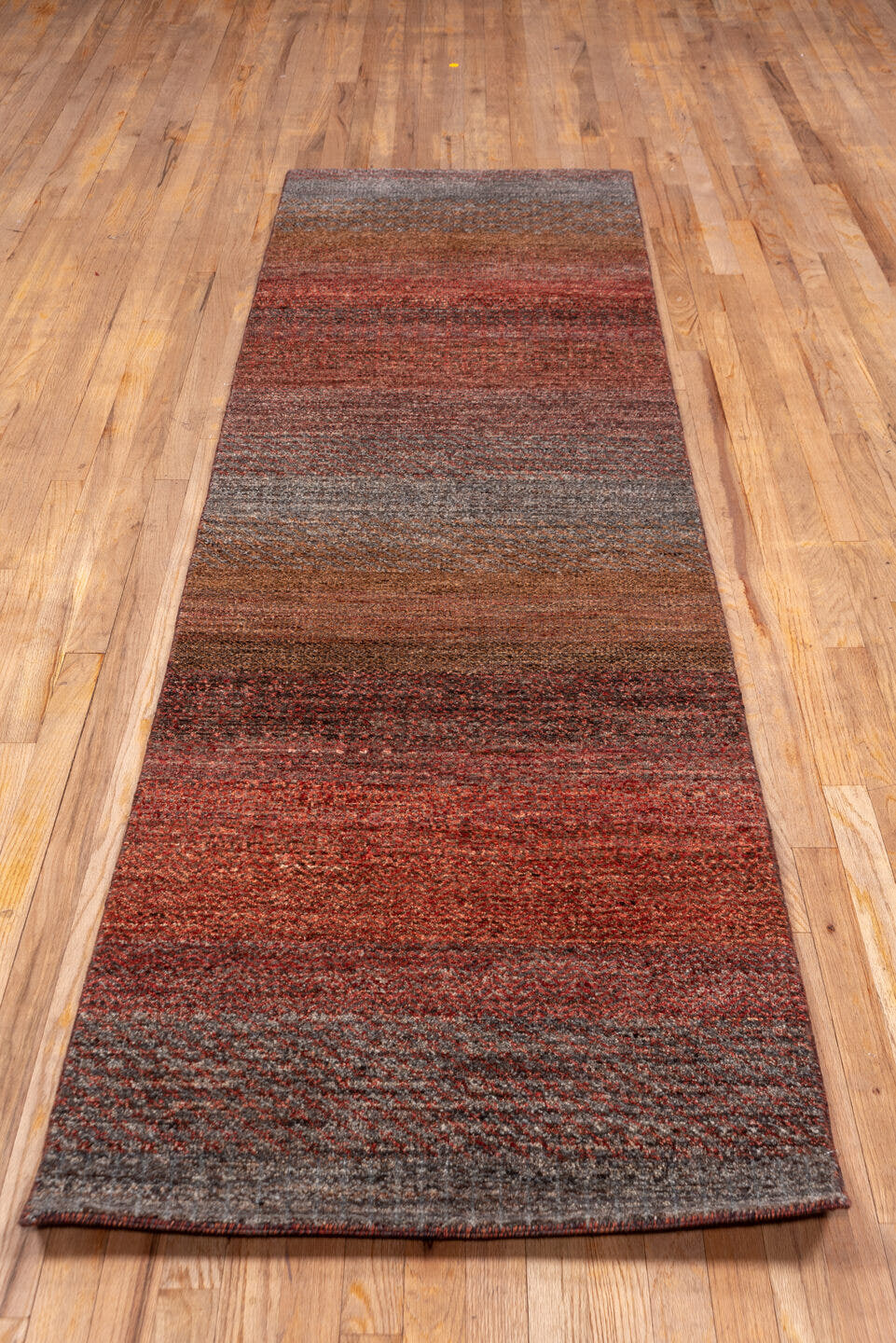 2' x 10' one-of-a-kind handmade vintage Gabbe runner rug. Color palette: rust, brown, taupe, brick, charcoal, terra cotta