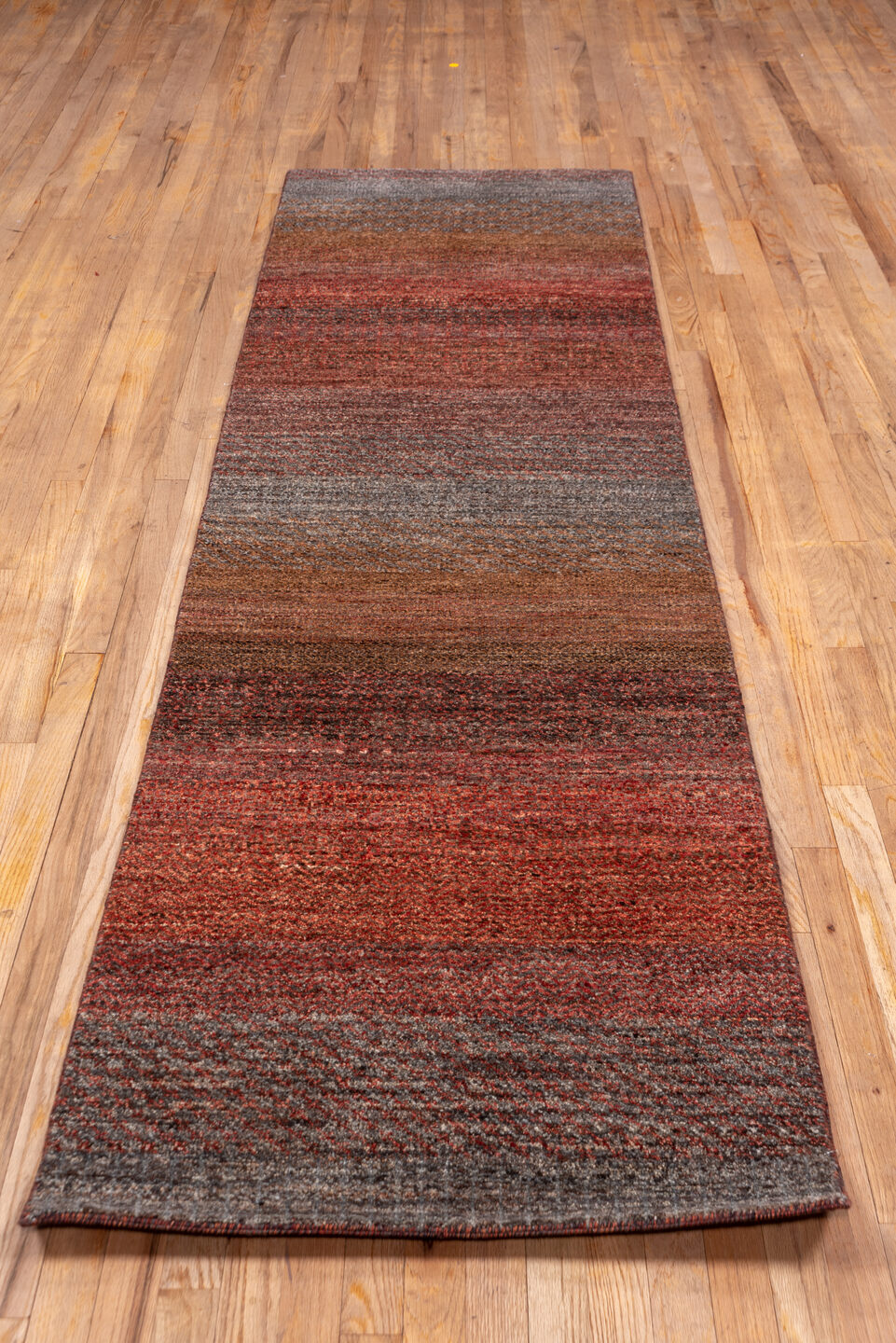 2' x 10' one-of-a-kind handmade vintage Gabbe runner rug. Color palette: rust, brown, taupe, brick, charcoal, terra cotta