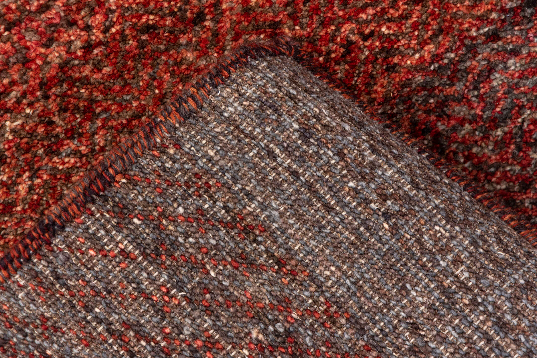 2' x 10' one-of-a-kind handmade vintage Gabbe runner rug. Color palette: rust, brown, taupe, brick, charcoal, terra cotta
