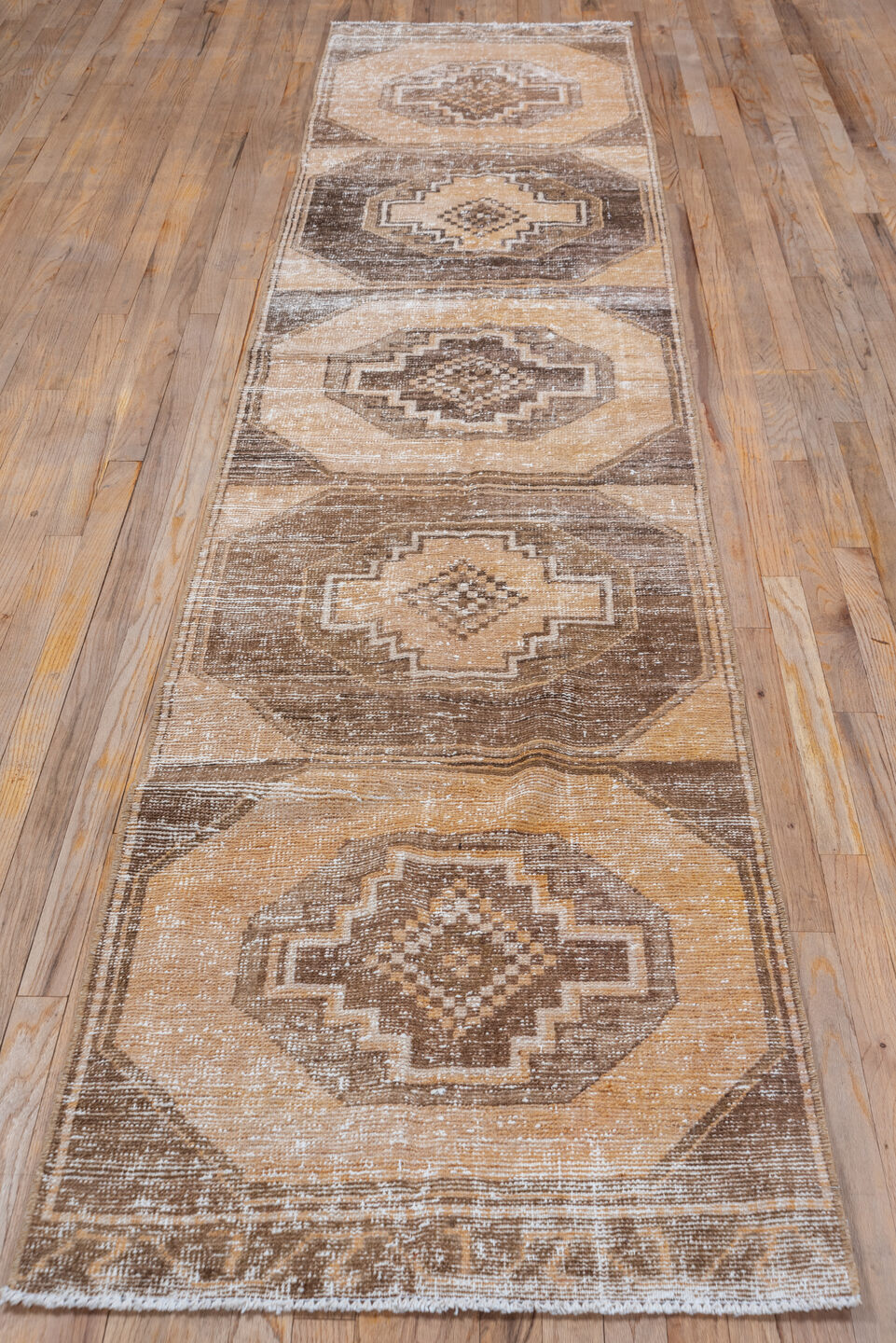 2' x 12' one-of-a-kind handmade vintage Oushak runner rug. Color palette: brown, off-white, orange, pink, snow, white