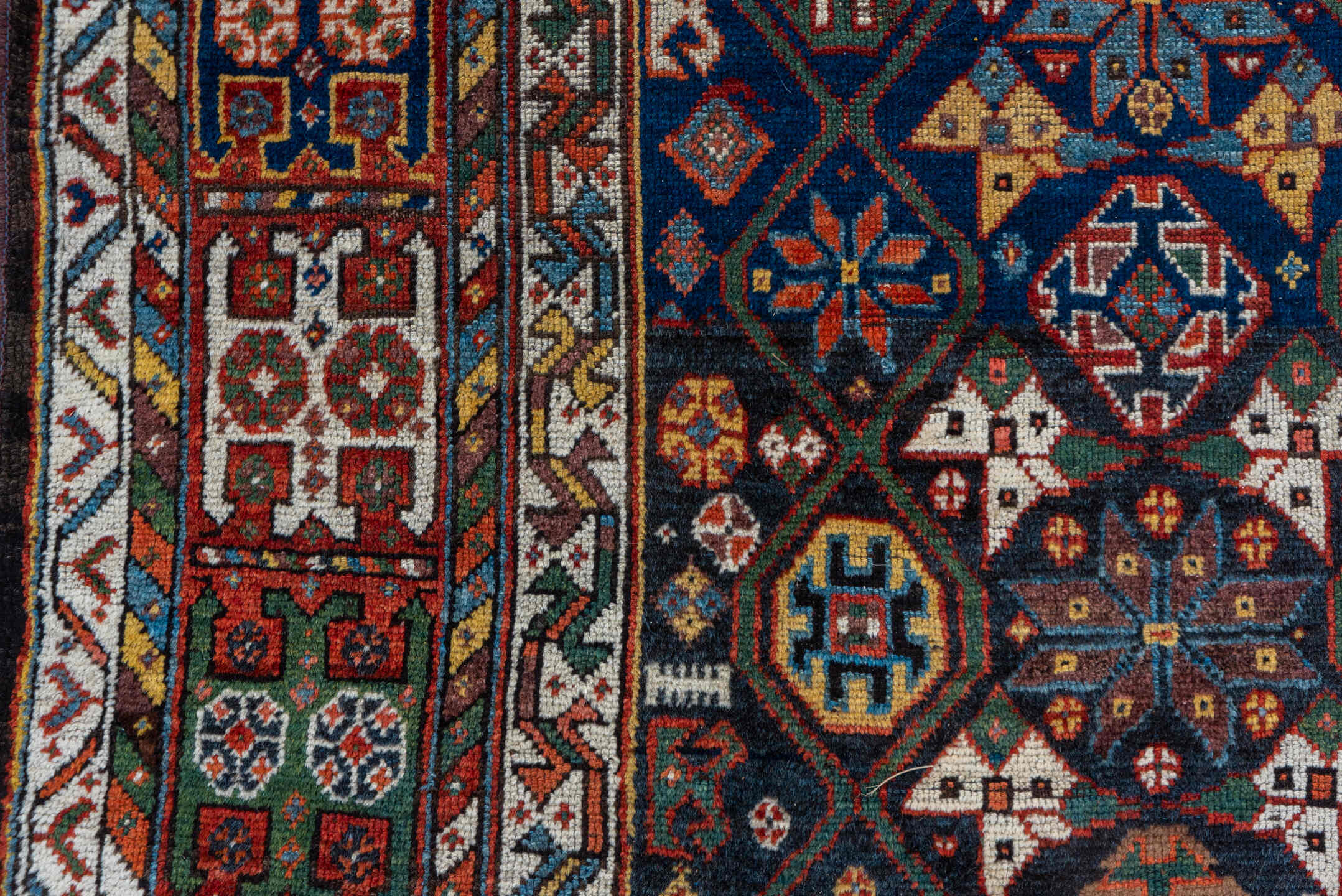 5' x 11' one-of-a-kind handmade vintage Baktiary rug. Color palette: navy, rust, ivory, indigo, gold, terra cotta, brown