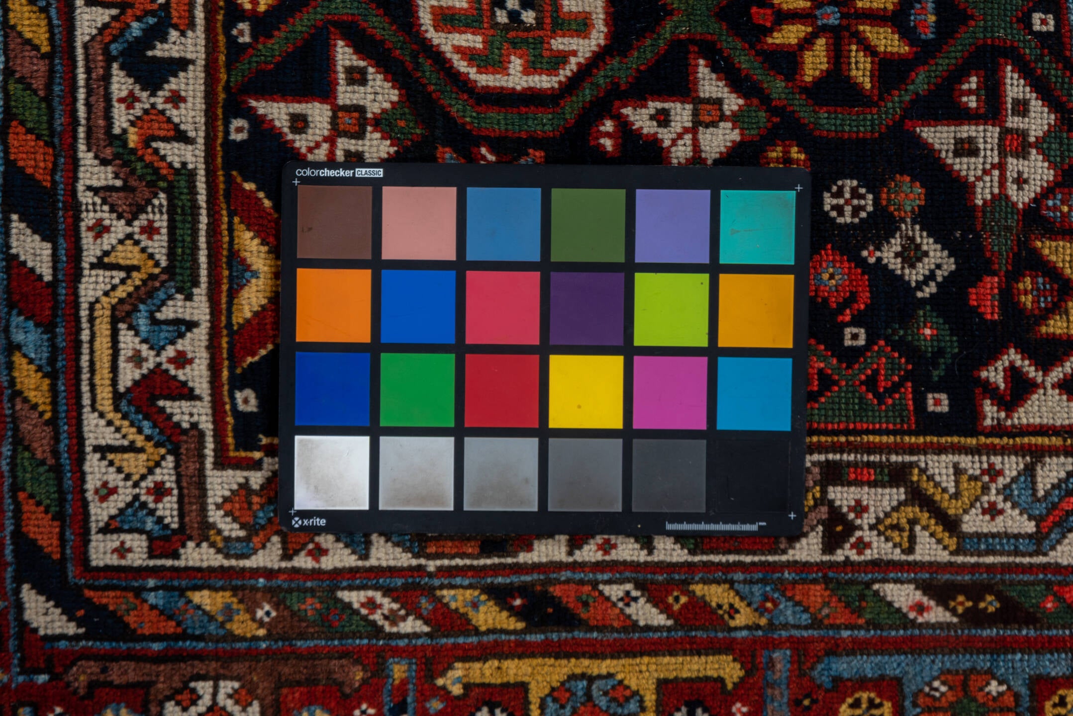 5' x 11' one-of-a-kind handmade vintage Baktiary rug. Color palette: black, blue, brown, gray, orange, pink, red