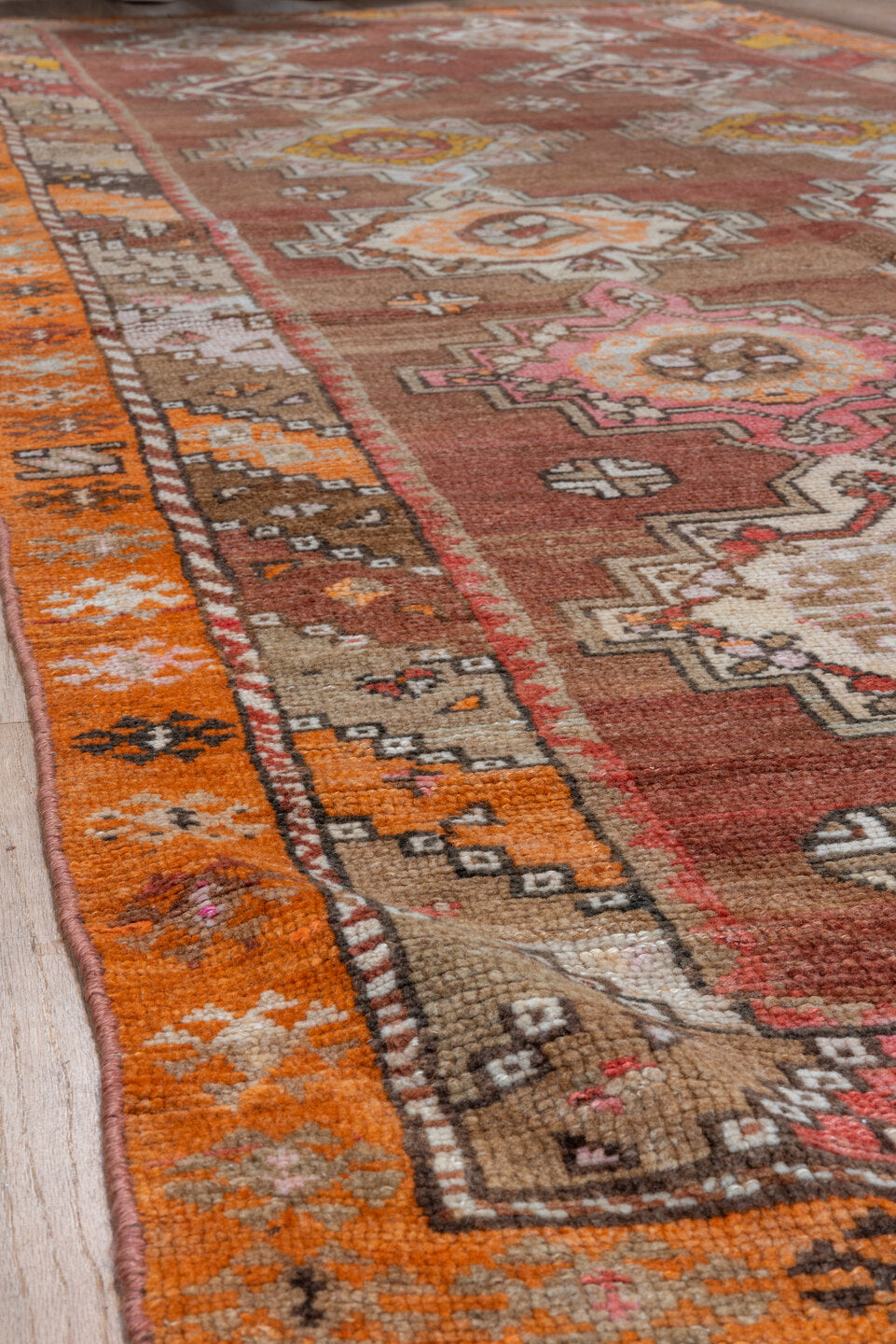 5' x 12' one-of-a-kind handmade vintage Kars runner rug. Color palette: rust, terra cotta, ivory, orange, taupe, gold, rose