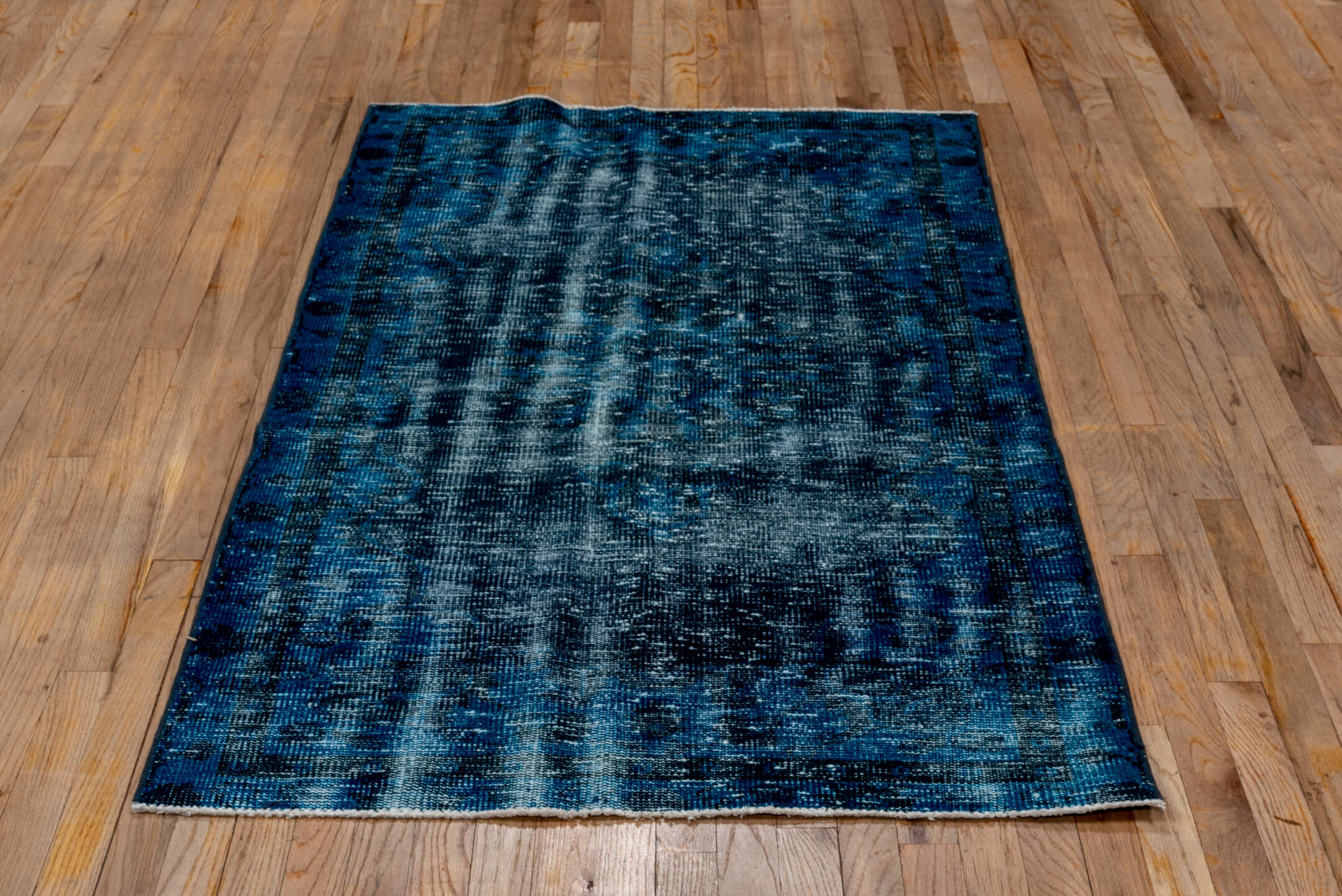3' x 6' one-of-a-kind handmade vintage Overdyed small size rug. Color palette: arapawa, blue, gray, light blue, light gray