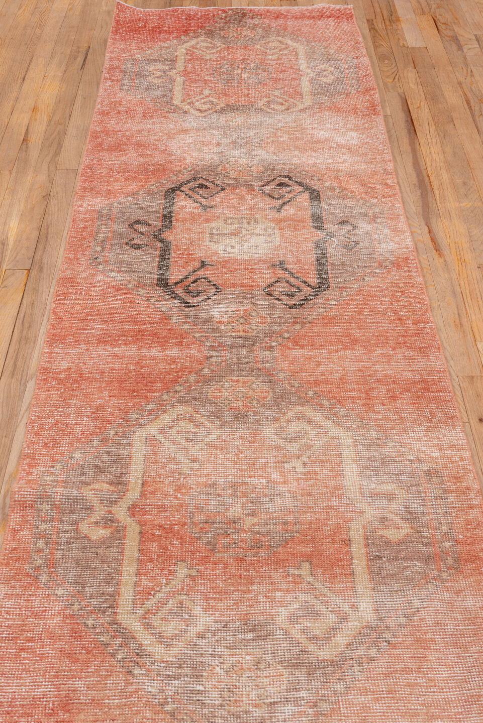 2' x 10' one-of-a-kind handmade vintage Oushak runner rug. Color palette: brown, off-white, orange, pink, snow, white