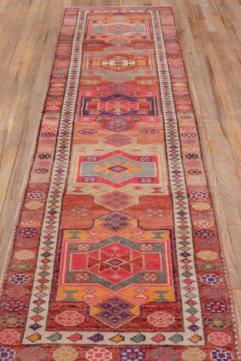 2' x 10' one-of-a-kind handmade vintage Oushak runner rug. Color palette: rose, rust, peach, ivory, plum, terra cotta, sage