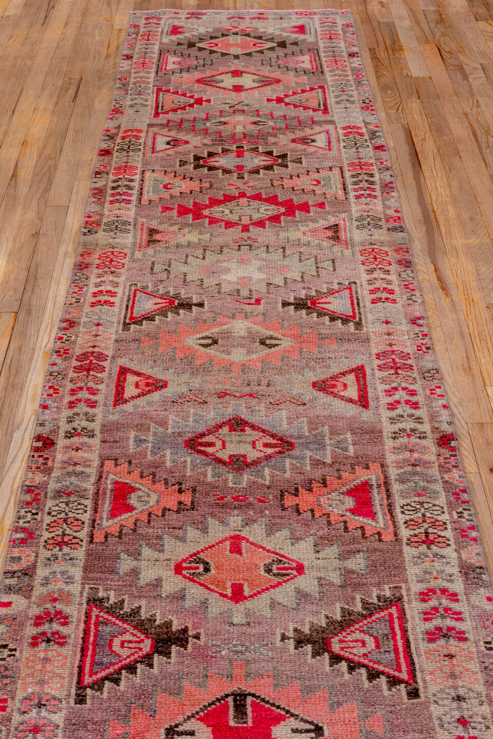 2' x 11' one-of-a-kind handmade vintage Oushak runner rug. Color palette: brown, gray, light gray, off-white, pink, red