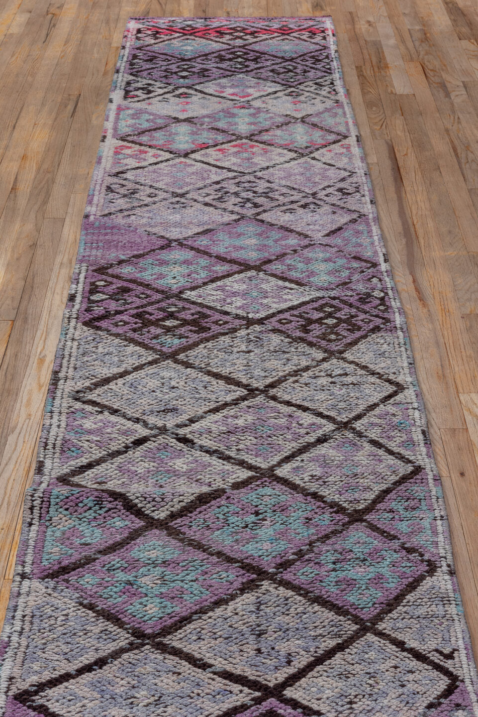 2' x 11' one-of-a-kind handmade vintage Oushak runner rug. Color palette: lavender, plum, ivory, aqua, rose, charcoal