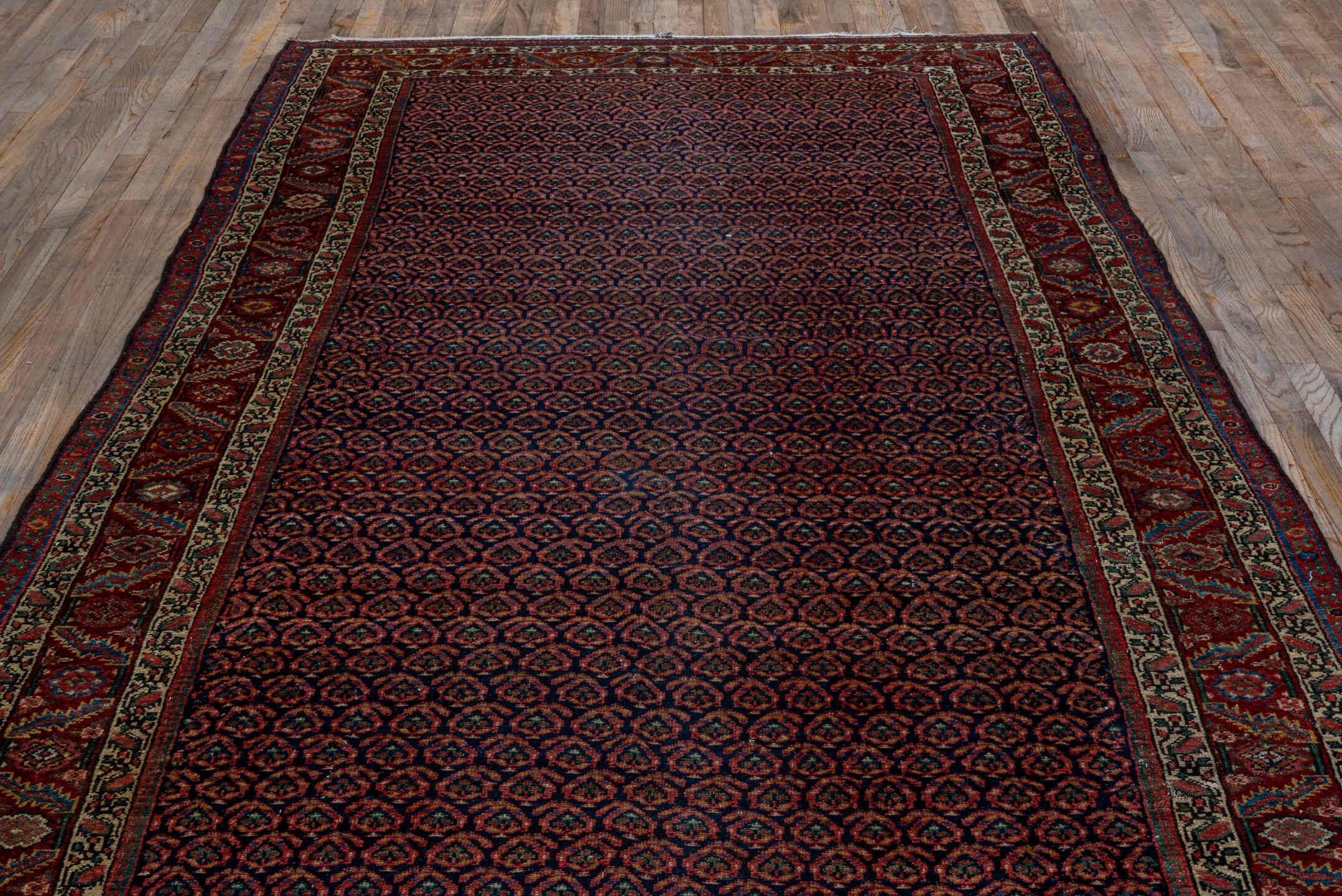 5' x 11' one-of-a-kind handmade vintage Malayer rug. Color palette: rust, navy, ivory, burgundy, camel, charcoal, terracotta