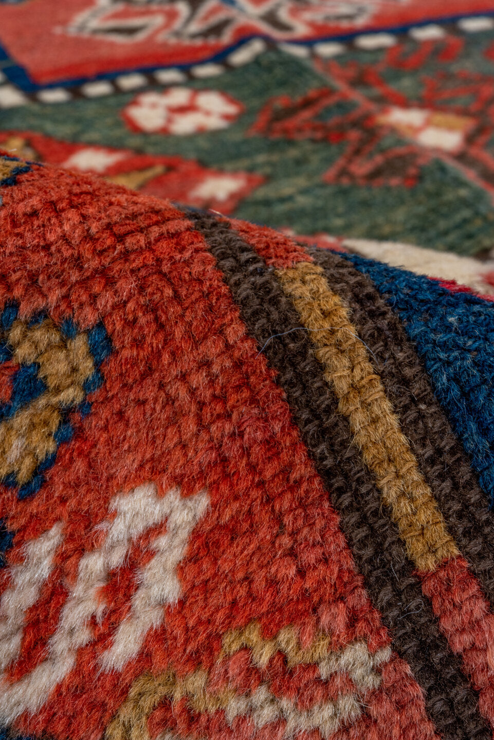 4' x 6' one-of-a-kind handmade vintage Kazak small size rug. Color palette: blue, brown, gray, pink, red