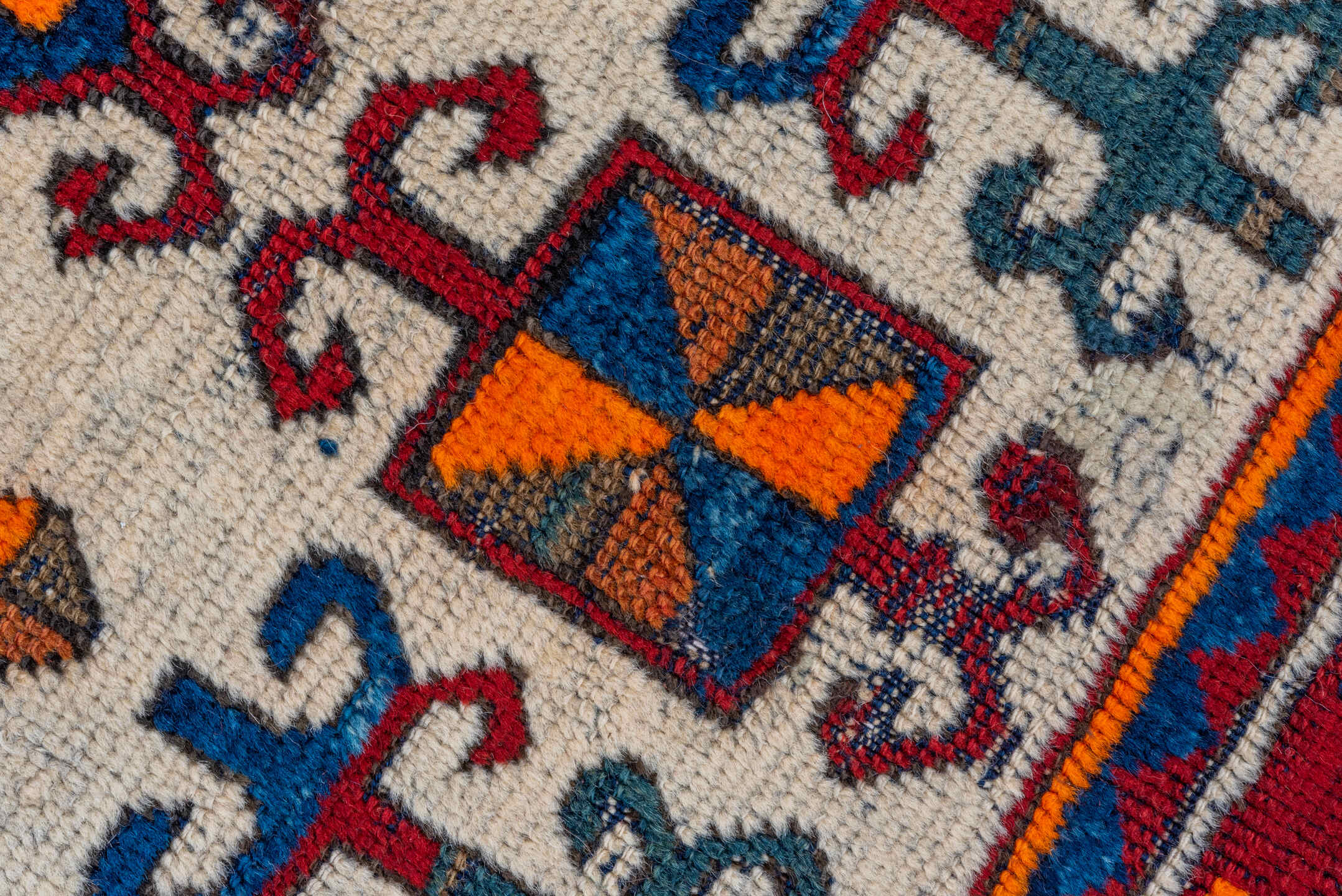 3' x 4' one-of-a-kind handmade vintage Kazak small size rug. Color palette: brown, gray, pink, red