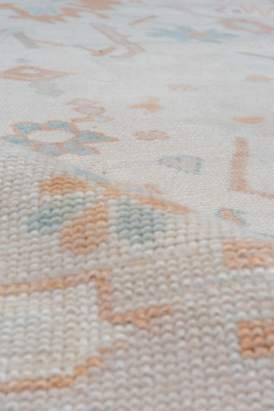 10' x 13' one-of-a-kind handmade vintage Oushak large size rug. Color palette: ivory, peach, aqua, sand, light blue, taupe