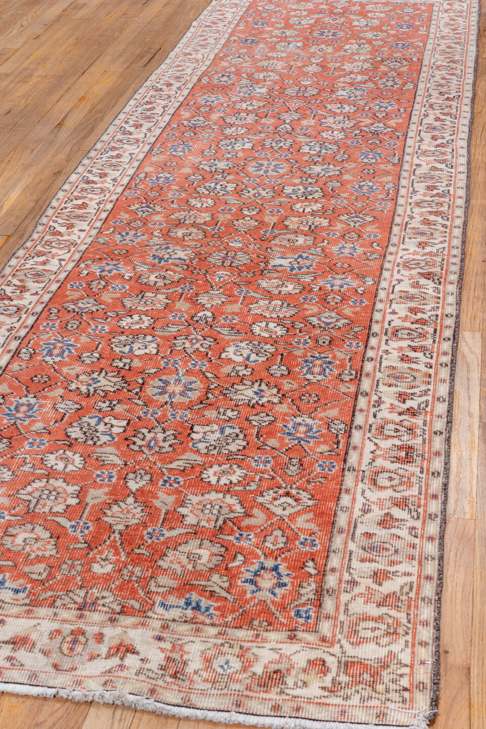 3' x 11' one-of-a-kind handmade vintage Oushak runner rug. Color palette: terra cotta, ivory, rust, blue, sage, taupe
