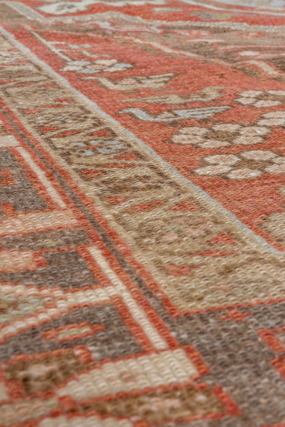 4' x 7' one-of-a-kind handmade vintage Serapi rug. Color palette: brown, gray, light gray, off-white, pink