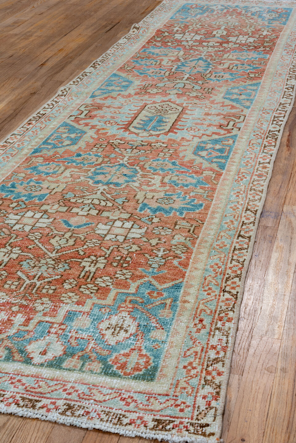2' x 10' one-of-a-kind handmade vintage Heriz runner rug. Color palette: blue, brown, gray, light gray, off-white, orange