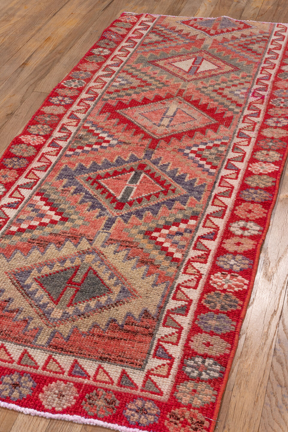 2' x 6' one-of-a-kind handmade vintage Oushak runner rug. Color palette: brown, gray, light gray, pink, red