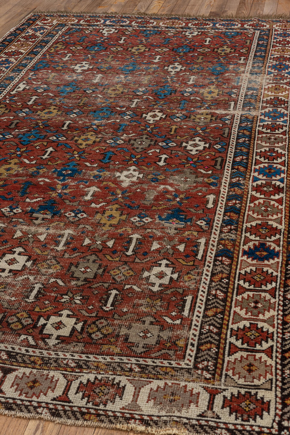 4' x 7' one-of-a-kind handmade vintage Shirvan rug. Color palette: rust, ivory, blue, camel, brown, charcoal, terracotta