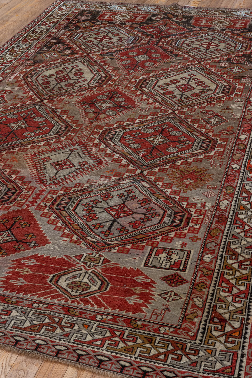 4' x 7' one-of-a-kind handmade vintage Shirvan rug. Color palette: ivory, crimson, charcoal, camel, taupe, mahogany, red