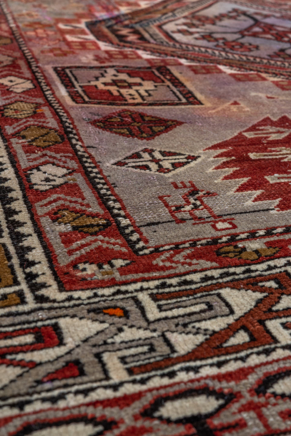 4' x 7' one-of-a-kind handmade vintage Shirvan rug. Color palette: ivory, crimson, charcoal, camel, taupe, mahogany, red