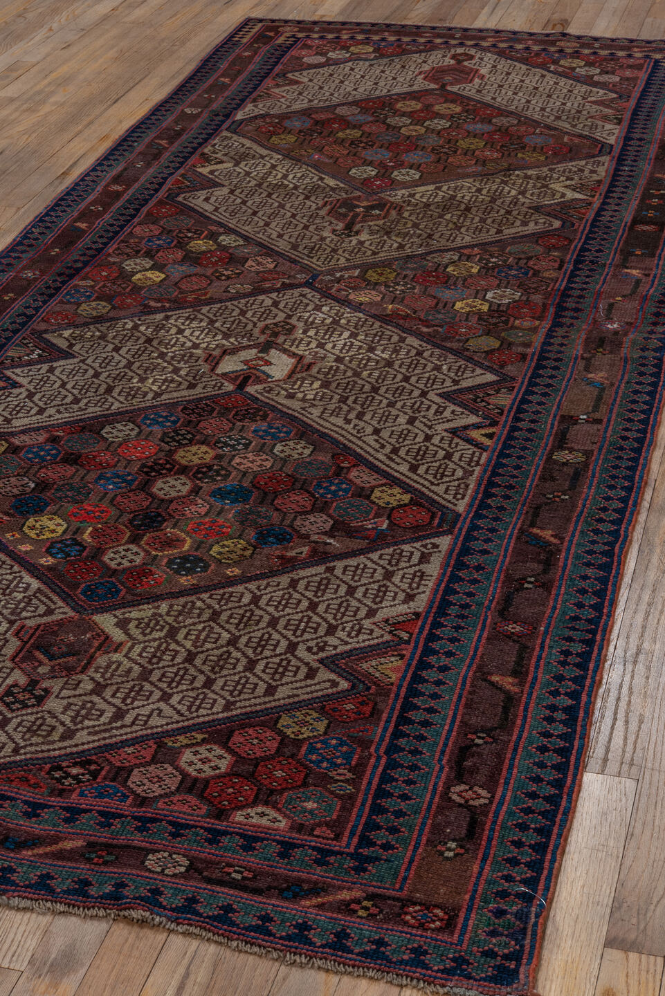 4' x 10' one-of-a-kind handmade vintage Cam Hamadan runner rug. Color palette: black, blue, brown, gray, pink, red, wine