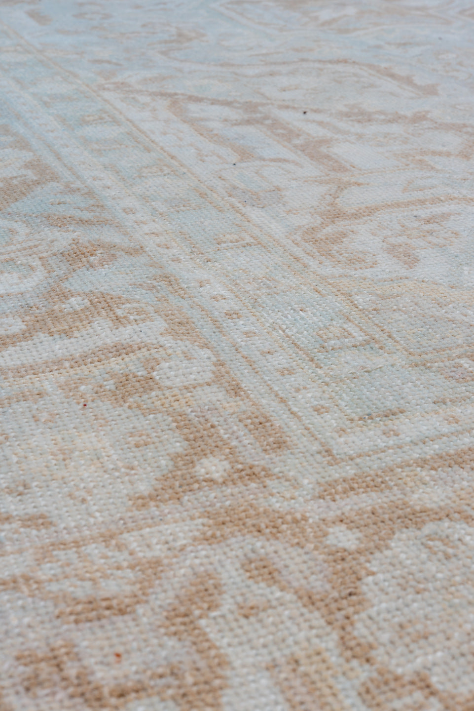 7' x 9' one-of-a-kind handmade vintage Heriz rug. Color palette: ivory, beige, taupe, camel, pale blue, gray, light blue