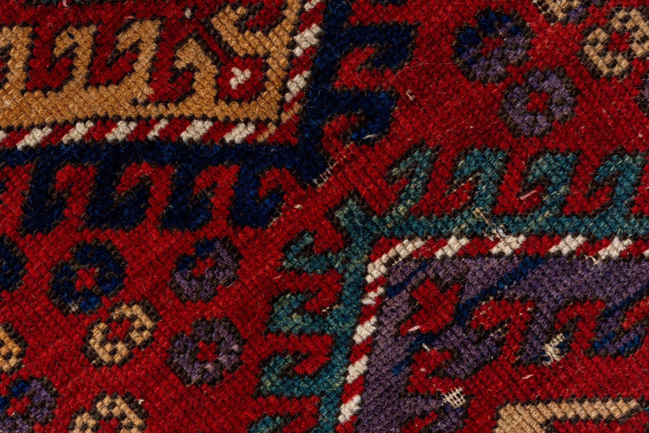 5' x 7' one-of-a-kind handmade vintage Kazak rug. Color palette: black, brown, gray, red, redwood
