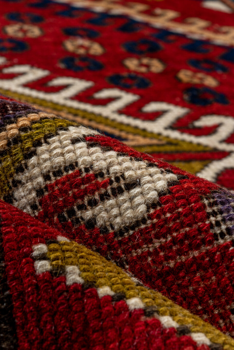 5' x 7' one-of-a-kind handmade vintage Kazak rug. Color palette: red, ivory, navy, olive, gold, rust, sky_blue, brown, blue