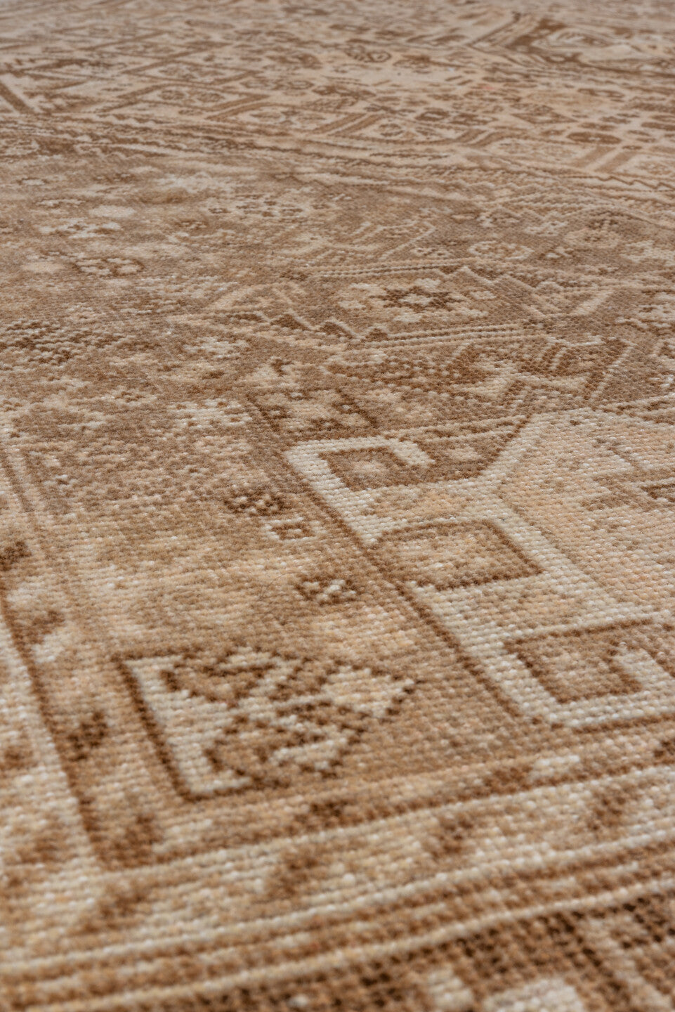 7' x 9' one-of-a-kind handmade vintage Shiraz rug. Color palette: camel, ivory, taupe, brown, sand, beige, gray