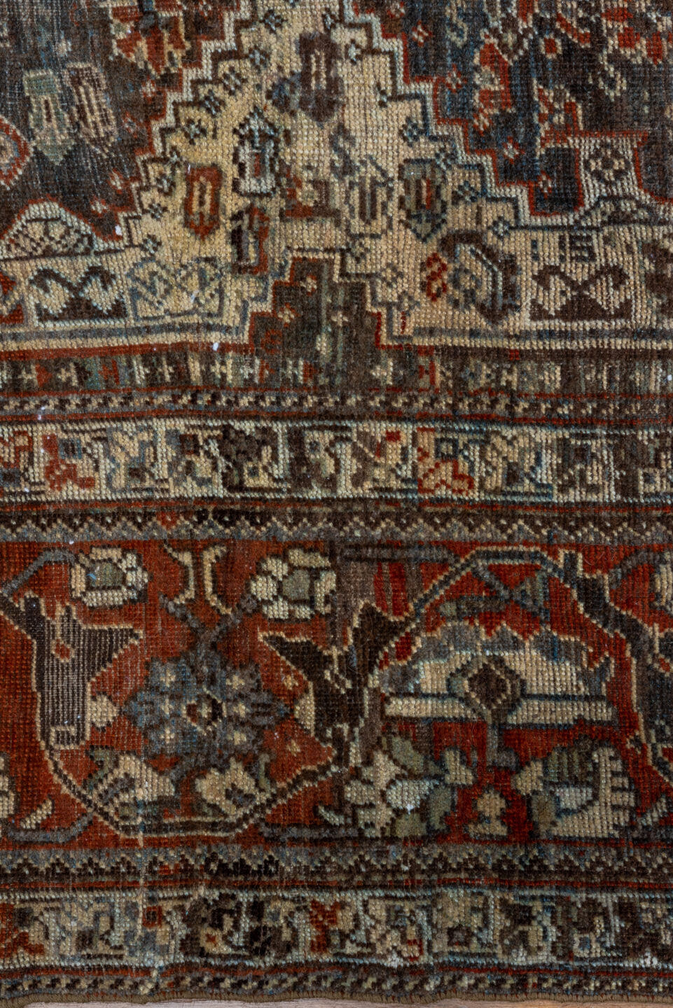 7' x 9' one-of-a-kind handmade vintage Shiraz rug. Color palette: rust, ivory, charcoal, slate, terracotta, brown, sky_blue