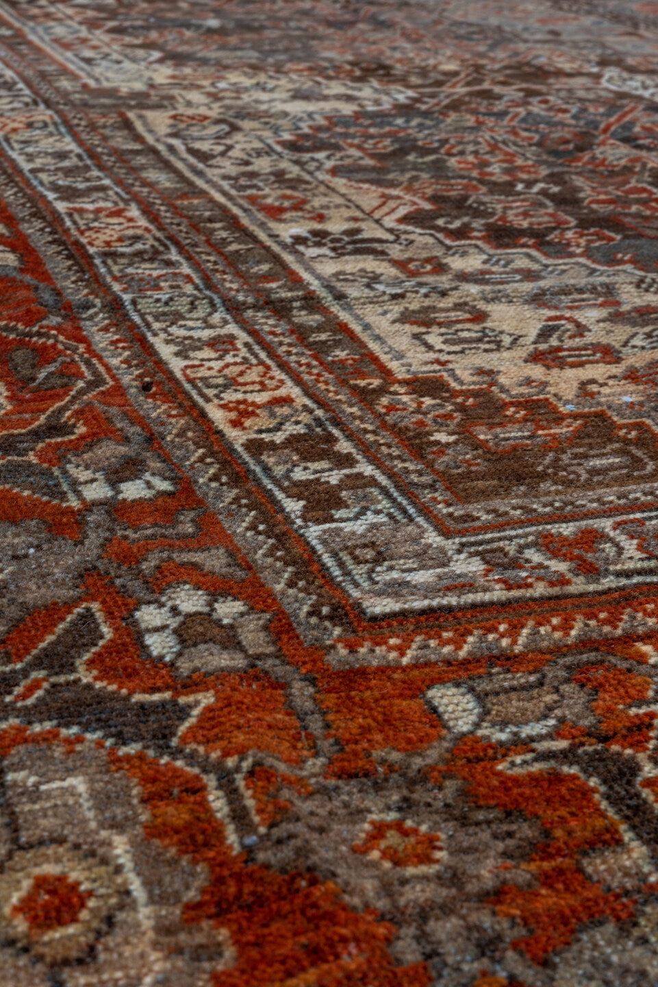 7' x 9' one-of-a-kind handmade vintage Shiraz rug. Color palette: rust, ivory, charcoal, slate, terracotta, brown, sky_blue