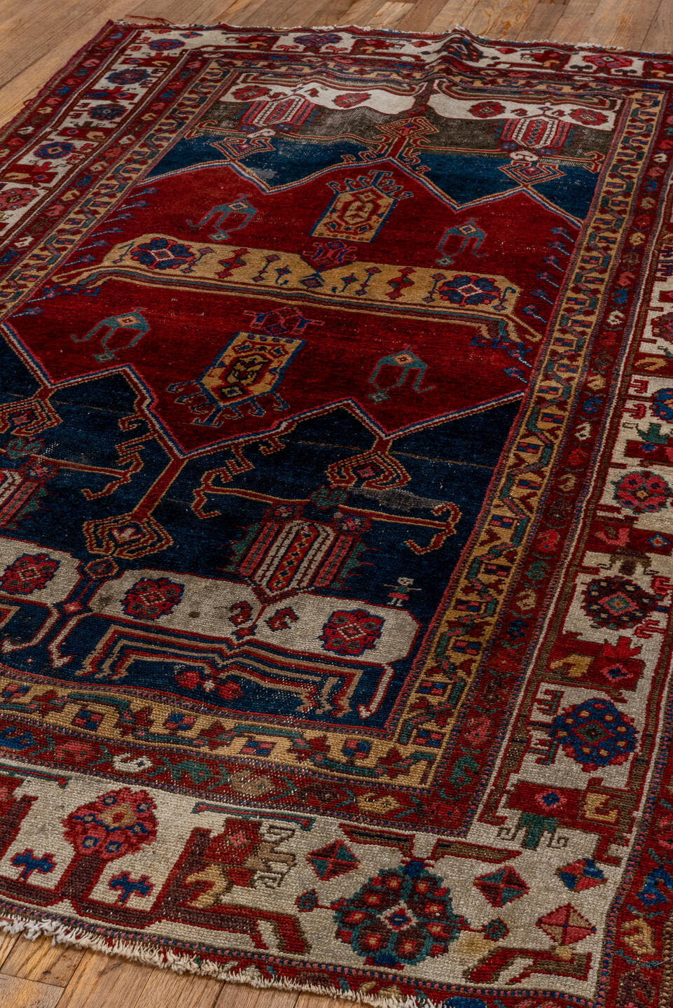 4' x 7' one-of-a-kind handmade antique Malayer rug. Color palette: crimson, navy, ivory, burgundy, camel, cobalt, taupe, red